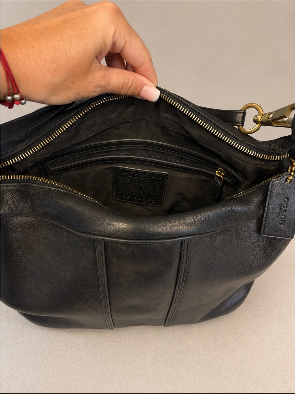 Coach Black Leather Shoulder Bag with Brass Hardware